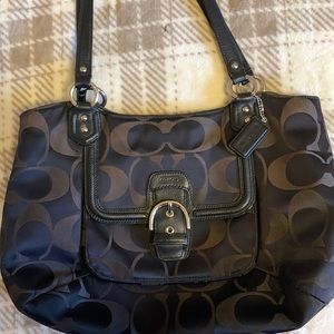 Coach with lots of sections and room! Tote or arm bag